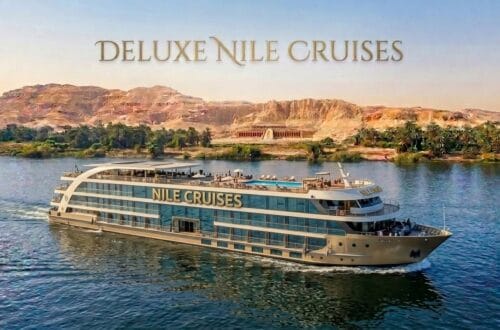 Deluxe Nile cruise ship sailing with mountains background