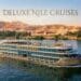 Deluxe Nile cruise ship sailing with mountains background